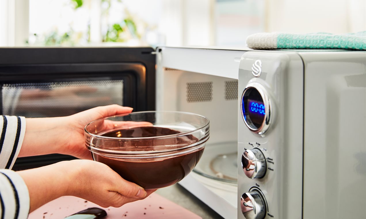 Picture - Removing Bowl of chocolate from Microwave